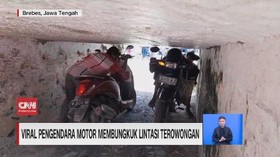 VIDEO: Viral Pemotor Membungkuk Lintasi Terowongan