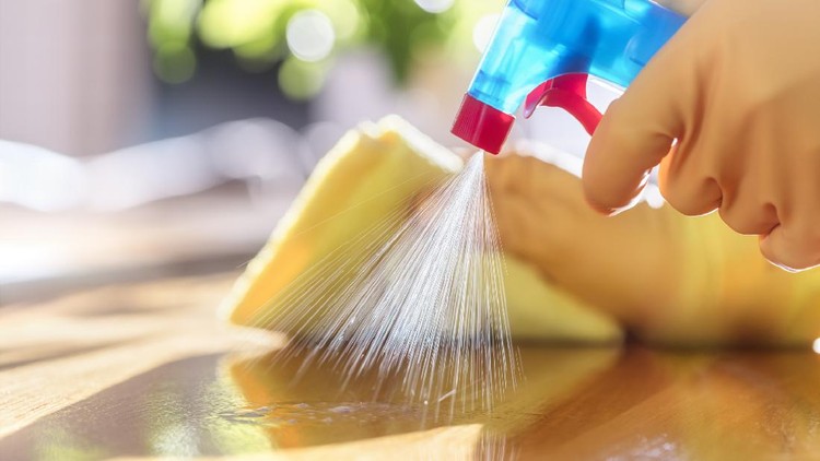 Cleaning with spray detergent, rubber gloves and dish cloth on work surface concept for hygiene