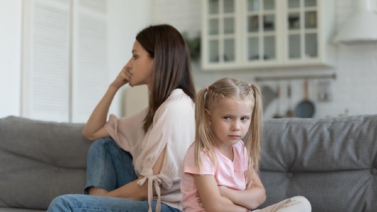 Sulking daughter dissatisfied mother sitting on couch looking different sides, family conflicts, misunderstanding and generational gap, older and younger female do not understand each other concept