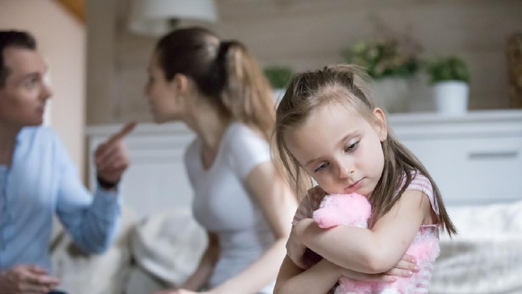 Sad little girl hug toy upset with parents fighting, frustrated small girl feel alone and depressed, mom and dad argue, lonely kid lack love and support. Psychology, family conflict, marriage break up
