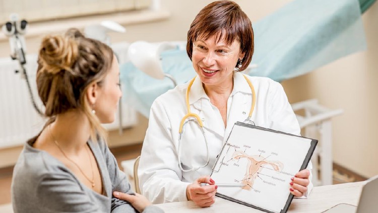 Young woman patient with a senior gynecologist during the consultation in the office