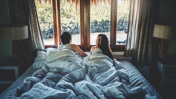 Couple love in bed on Holiday time Honeymoon vacation  summer concept