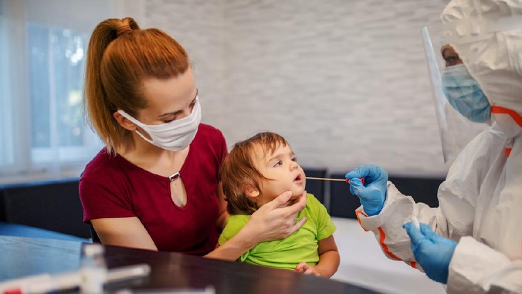 1262681192 Little Girl During a Mouth Swab Medical Test at the Hospital