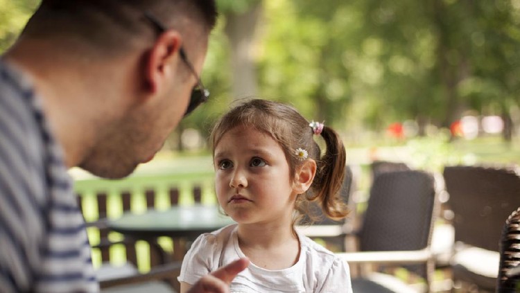 Shot of a father disciplining his daughter at home