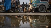 FOTO: Petani India Kepung Ibu Kota Tuntut UU Pertanian Baru Para petani India berdemo memakai truk dan trailer di ibu kota India untuk menuntut UU Pertanian Baru