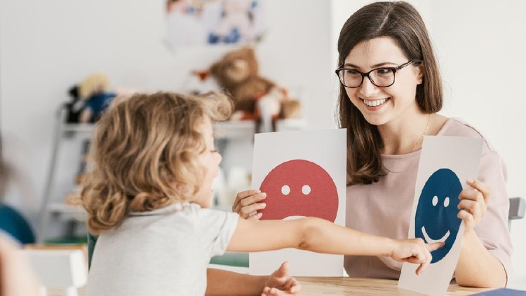 Emotion emoticons used by a psychologist during a therapy session with a child with an autism spectrum disorder.