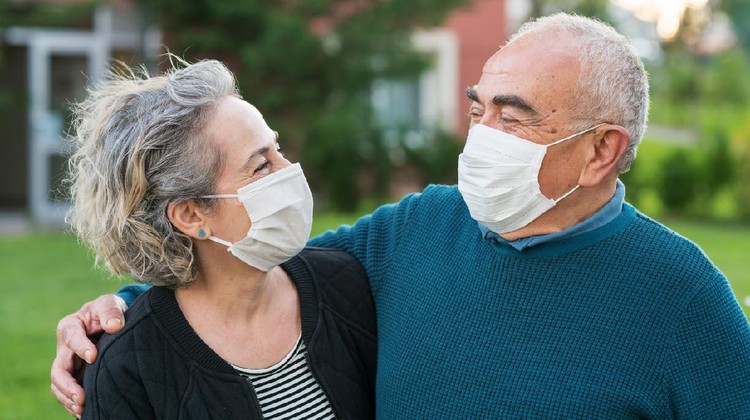 Couple wear surgical masks