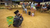 FOTO: Menjaga Partisipasi Pilkada 2020 di Tengah Pandemi Di tengah pandemi corona yang belum juga mereda, sejumlah penyesuaian pun dilakukan agar Pilkada 2020 terlaksana dengan tingkat partisipasi tinggi.