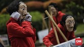 FOTO: Aksi 'Salvador Dali' #BersihkanIndonesia di Monas Sejumlah aktivis #BersihkanIndonesia berkostum merah bertopeng Salvador Dali melakukan aksi di Monas mengajak masyarakat melakukan pembersihan kebijakan korup.