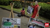 FOTO: Aksi 'Salvador Dali' #BersihkanIndonesia di Monas Sejumlah aktivis #BersihkanIndonesia berkostum merah bertopeng Salvador Dali melakukan aksi di Monas mengajak masyarakat melakukan pembersihan kebijakan korup.