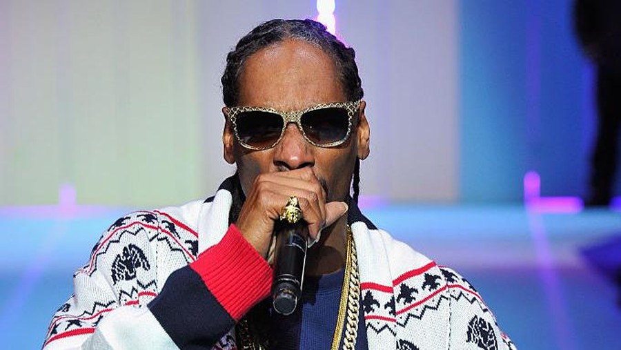 PARIS, FRANCE - MARCH 03:  Hip Hop Artist Snoop Dogg performs during the ETAM show as part of the Paris Fashion Week Womenswear Fall/Winter 2015/2016 at Piscine Molitor on March 3, 2015 in Paris, France.  (Photo by Kristy Sparow/Getty Images for ETAM)