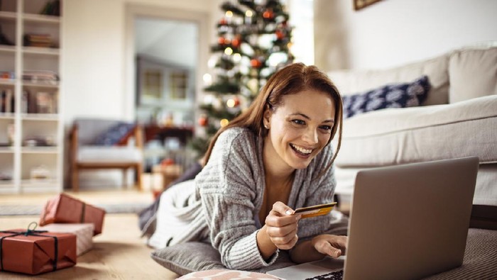 Close up of a young woman buying presents online