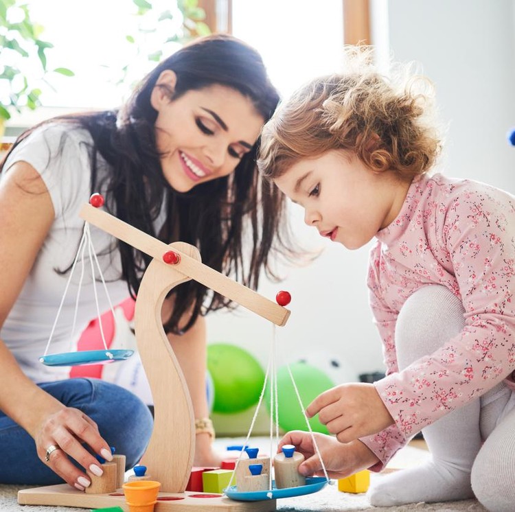 Ilustrasi mainan anak Mother spending time with her daughter playing with toys