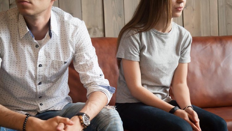 Frustrated unhappy young couple sitting on sofa after fight, disappointed boyfriend and offended girlfriend breaking up thinking of problems in bad relationships, misunderstandings and insult concept