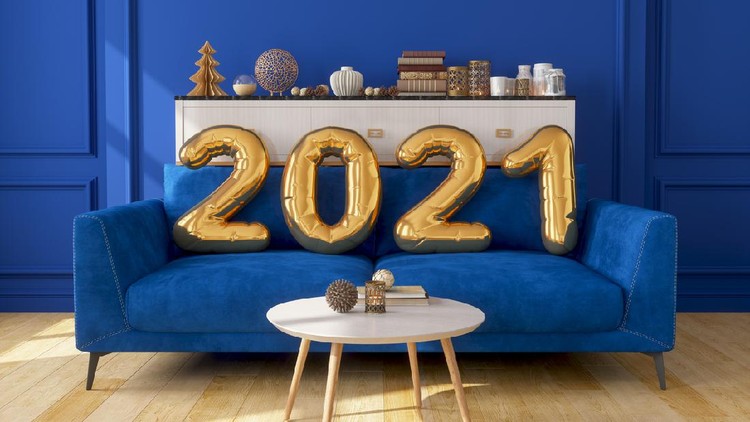 Gold Colored 2021 Year Balloons On The Sofa With Blue Wall.