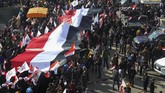 FOTO: Peringatan Setahun Pembunuhan Jenderal Iran Puluhan ribu warga Iran turun ke jalan di kota Teheran untuk memperingati satu tahun kematian Jenderal Qasem Soleimani yang tewas dibunuh oleh Amerika Serikat.