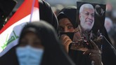 FOTO: Peringatan Setahun Pembunuhan Jenderal Iran Puluhan ribu warga Iran turun ke jalan di kota Teheran untuk memperingati satu tahun kematian Jenderal Qasem Soleimani yang tewas dibunuh oleh Amerika Serikat.