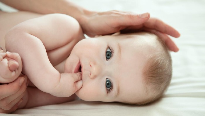 close-up portrait of baby boy and his mother