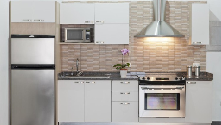 Bright kitchen with white furniture and a bright yellow fridge