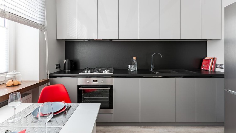 Bright kitchen with white furniture and a bright yellow fridge