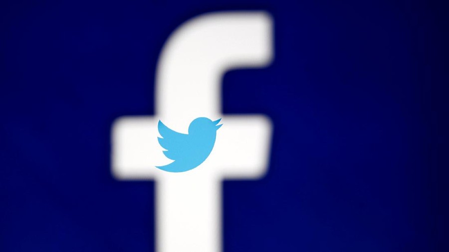 FILE PHOTO: A 3D-printed Facebook logo is displayed in front of the Twitter logo, in this illustration taken October 25, 2017. REUTERS/Dado Ruvic/Illustration/File Photo