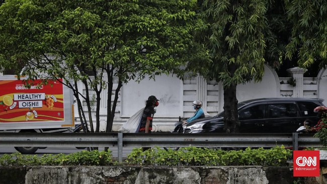 FOTO : Potret Mendung Orang-orang Pinggiran di Jakarta