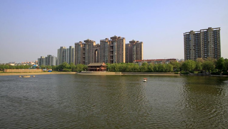 Buildings and trees in a city, closeup of photo