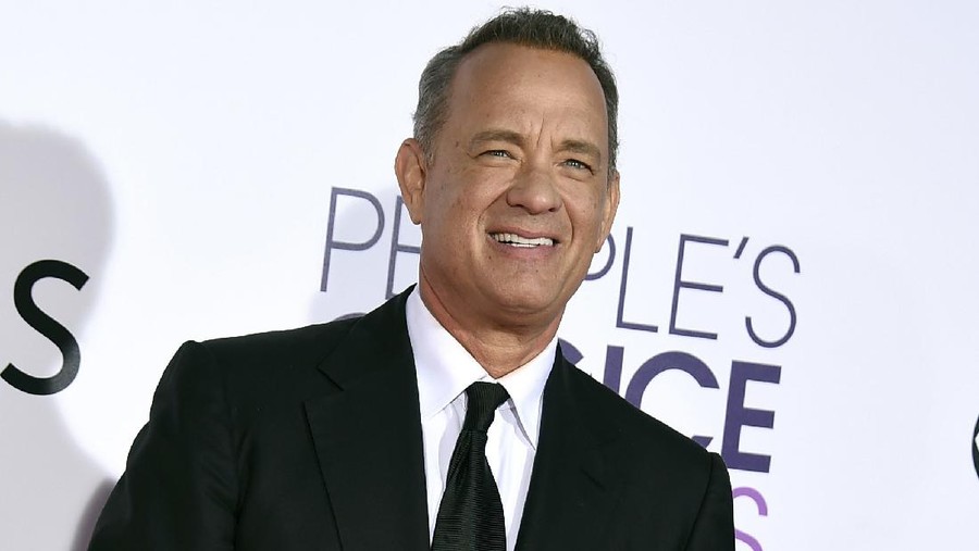 Biden Inauguration-Entertainment FILE - In this Wednesday, Jan. 18, 2017, file photo, Tom Hanks arrives at the People's Choice Awards at the Microsoft Theater in Los Angeles. Hanks will host a 90-minute primetime TV special celebrating the inauguration of Joe Biden as president of the United States. (Photo by Jordan Strauss/Invision/AP, File)