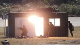 FOTO: Taiwan Latihan Militer Antisipasi Serangan China Taiwan menggelar latihan militer pada Selasa (19/1) untuk mengantisipasi serangan dari China.