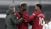 FOTO: Pogba Antar Man Utd Kembali ke Puncak Klasemen Manchester United kembali ke puncak klasemen Liga Inggris setelah mengalahkan Fulham 2-1 di Stadion Craven Cottage, Kamis (21/1).