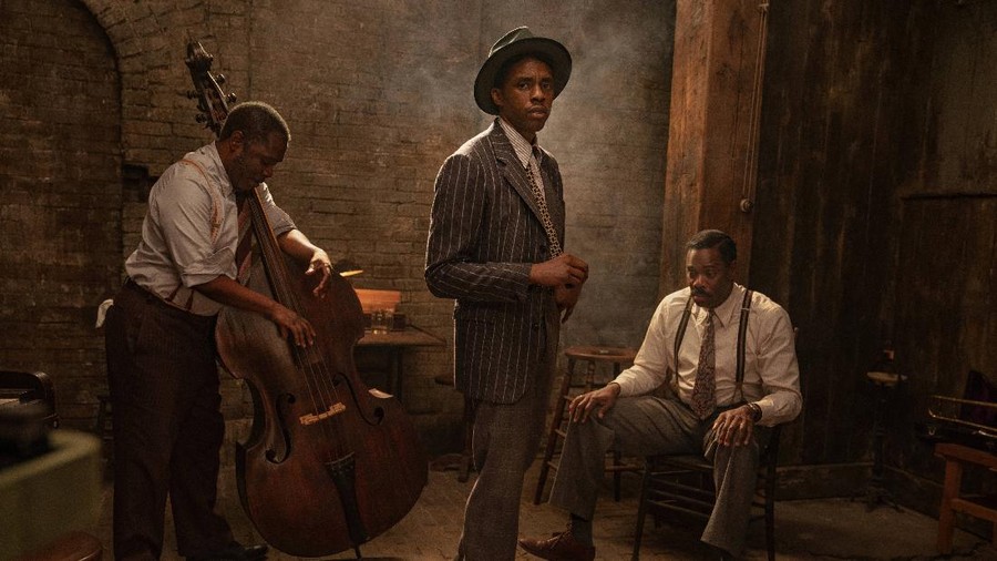 This image released by Netflix shows Michael Potts, from left, Chadwick Boseman and Colman Domingo in 