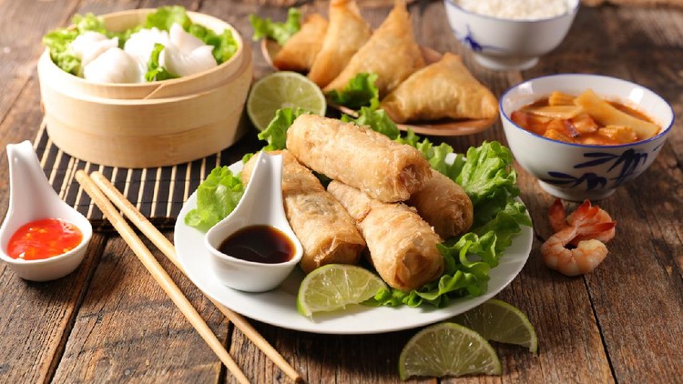 assorted of asian food- spring roll, noodles soup, dim sum