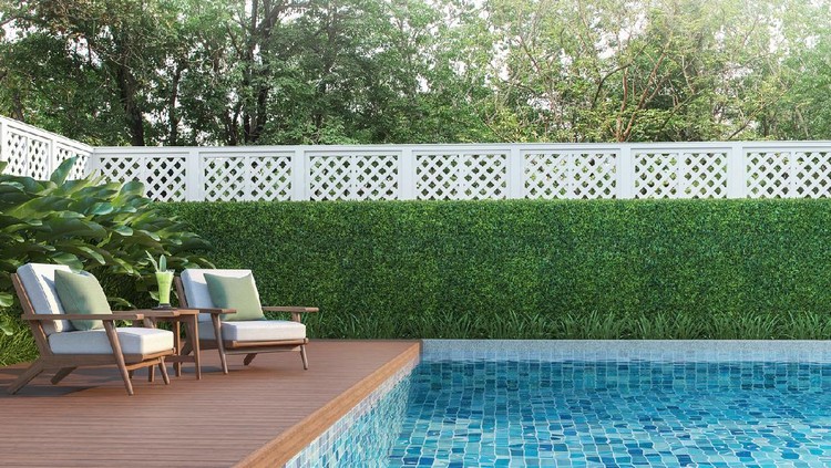 Swimming pool terrace in the garden 3d render,  There are a wooden floor ,Blue tile in the swimming pool and white fence,Decorated with wooden and white fabric furniture,Surrounded by nature.