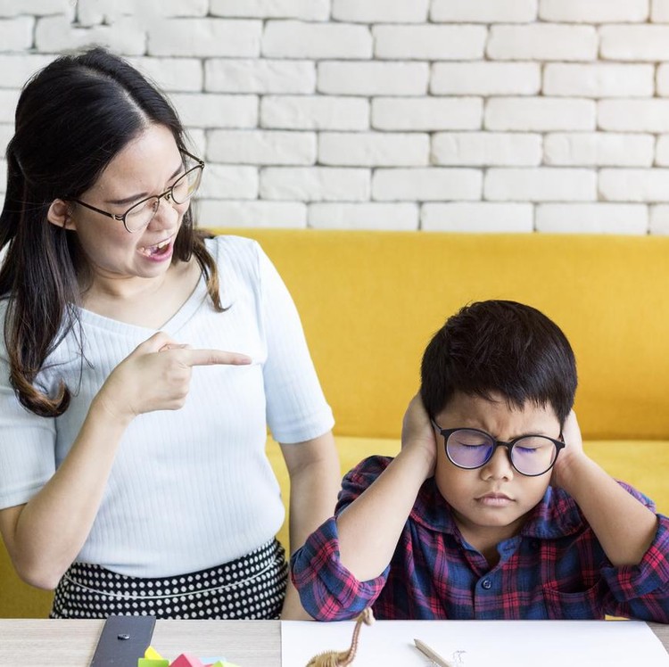 Ilustrasi tiger mom atau tiger parenting Family concept;Mother rebuke her son and he feels guilty and holding head. The boy cannot do his homework.