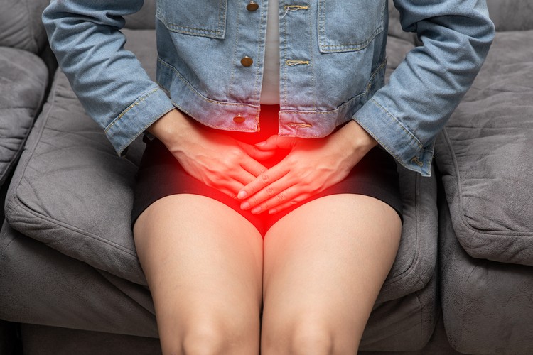 woman have bladder or uti pain sitting on bed in bedroom after wake up feeling so illness,Healthcare concept