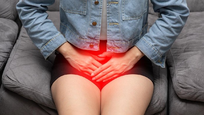 woman have bladder or uti pain sitting on bed in bedroom after wake up feeling so illness,Healthcare concept
