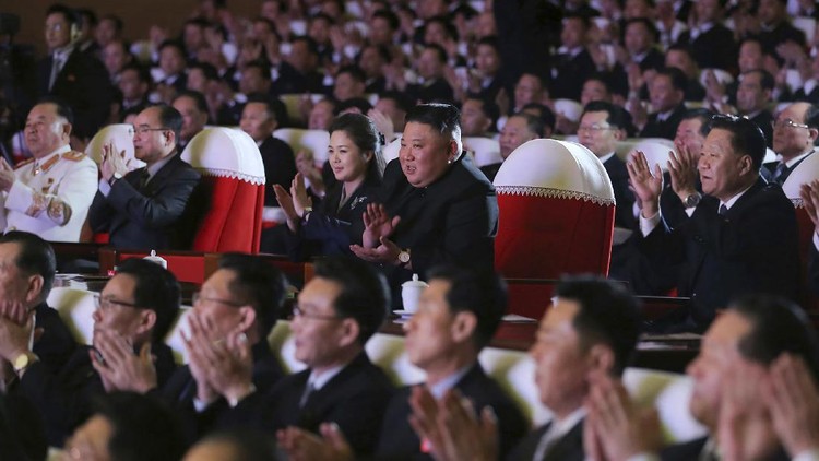 In this photo provided by the North Korean government, North Korean leader Kim Jong Un, center, and his wife Ri Sol Ju watch a performance marking the birth anniversary of former leader Kim Jong Il, in Pyongyang, North Korea, Tuesday, Feb. 16, 2021. Ri has reappeared in North Korea's state media for the first time in just over year. Independent journalists were not given access to cover the event depicted in this image distributed by the North Korean government. The content of this image is as provided and cannot be independently verified. Korean language watermark on image as provided by source reads: 