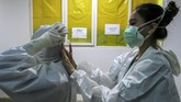 FOTO: Perjuangan Nakes Obati Luka Setahun Corona Tenaga kesehatan berdiri di barisan depan dalam menangani pandemi Covid-19. Segala tenaga tercurah, bahkan hingga bertaruh nyawa.
