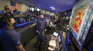 In this photo provided by NASA, members of NASA's Perseverance Mars rover team watch in mission control as the first images arrive moments after the spacecraft successfully touched down on Mars, Thursday, Feb. 18, 2021, at NASA's Jet Propulsion Laboratory in Pasadena, Calif. (Bill Ingalls/NASA via AP)