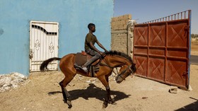 FOTO: Mimpi Pembalap Kuda Termuda di Senegal