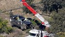 A vehicle is towed away from the site of a crash involving golfer Tiger Woods&comma; Tuesday&comma; Feb&period; 23&comma; 2021&comma; in the Rancho Palos Verdes suburb of Los Angeles&period; &lpar;AP Photo&sol;Ashley Landis&rpar;