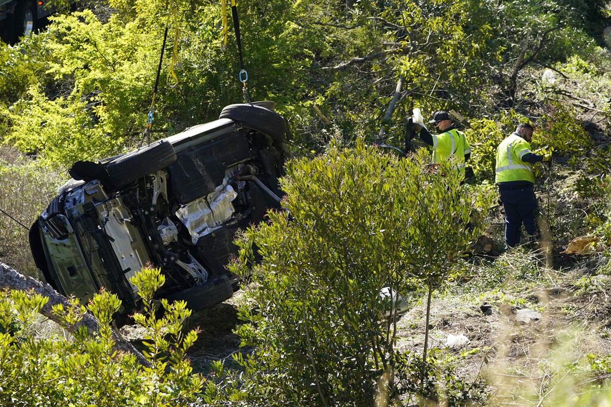 A vehicle is towed away from the site of a crash involving golfer Tiger Woods&comma; Tuesday&comma; Feb&period; 23&comma; 2021&comma; in the Rancho Palos Verdes suburb of Los Angeles&period; &lpar;AP Photo&sol;Ashley Landis&rpar;