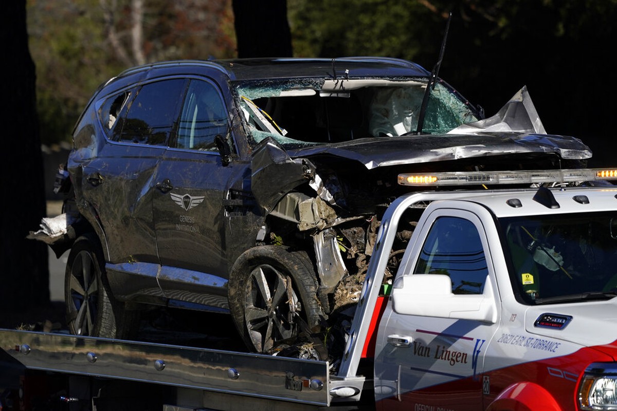 A vehicle is towed away from the site of a crash involving golfer Tiger Woods&comma; Tuesday&comma; Feb&period; 23&comma; 2021&comma; in the Rancho Palos Verdes suburb of Los Angeles&period; &lpar;AP Photo&sol;Ashley Landis&rpar;