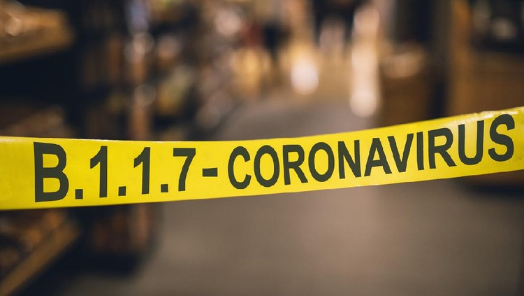 Ilustrasi Corona B117 Yellow SARS-CoV-2 lineage B.1.1.7 mutation virus tape barrier beyond a quarantine point.