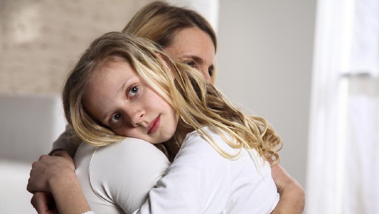 Mother and daughter embracing. Mother is consoling her girl.