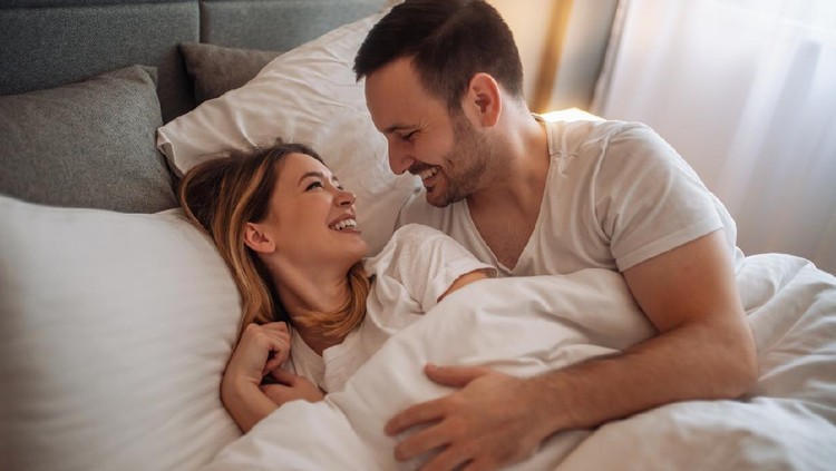 Happy couple sleeping in bed at home.Young cute couple sleeping together in bed.Romantic moments.