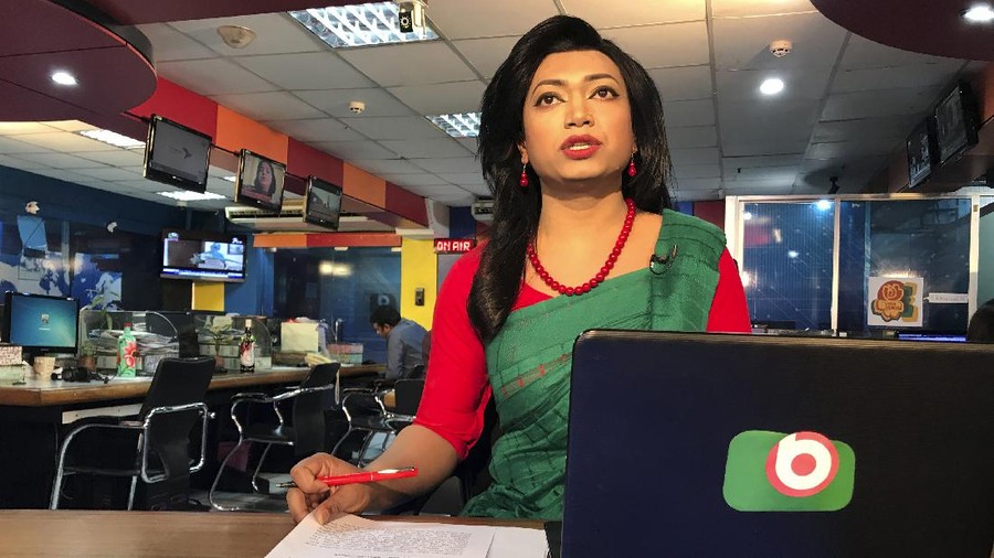 Bangladesh's first transgender news anchor Tashnuva Anan Shishir reads news bulletin , in Dhaka, Bangladesh, Tuesday, March 9, 2021. A Bangladeshi satellite television station has signed up the South Asian county's first transgender news anchor with a hope to remove the deeply-rooted social stigma they face. Shishir, who previously worked as a rights activist and an actor, appeared before audience on Monday after her appointment recently as the day coincided with the International Women's Day. She made the debut by reading a three-minute daily news bulletin on Dhaka-based Boishakhi TV. (AP Photo/Al-emrun Garjon)