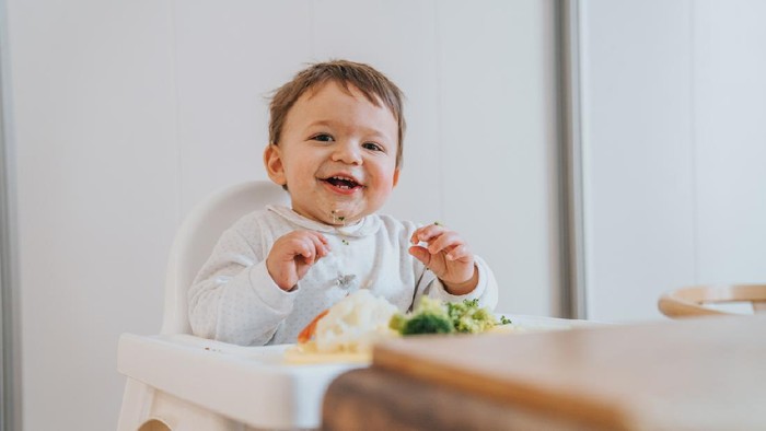 Baby eating vegetables
