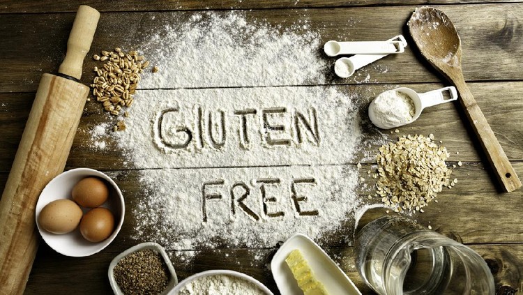 Gluten free bread ingredients and utensils on wood frame background. Gluten sensitivity or non-celiac gluten sensitivity (NCGS) is a health disorder induced by the ingestion of gluten causing intestinal and/or extraintestinal symptoms. It is resolved once the gluten containing food is eliminated from the diet, and when celiac disease and wheat allergy have been alleviated. The pathogenesis of non-celiac gluten sensitivity is not yet well understood. It was hypothesized that gluten, as occurs in celiac disease, is the cause of non-celiac gluten sensitivity. Besides gluten, other components in wheat, rye, barley, and their derivatives may cause the same symptoms.