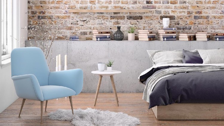 Bedroom interior with large bed, modern nightstand and wall lamp, armchair, many books around, plant, blank wall. Copy space template